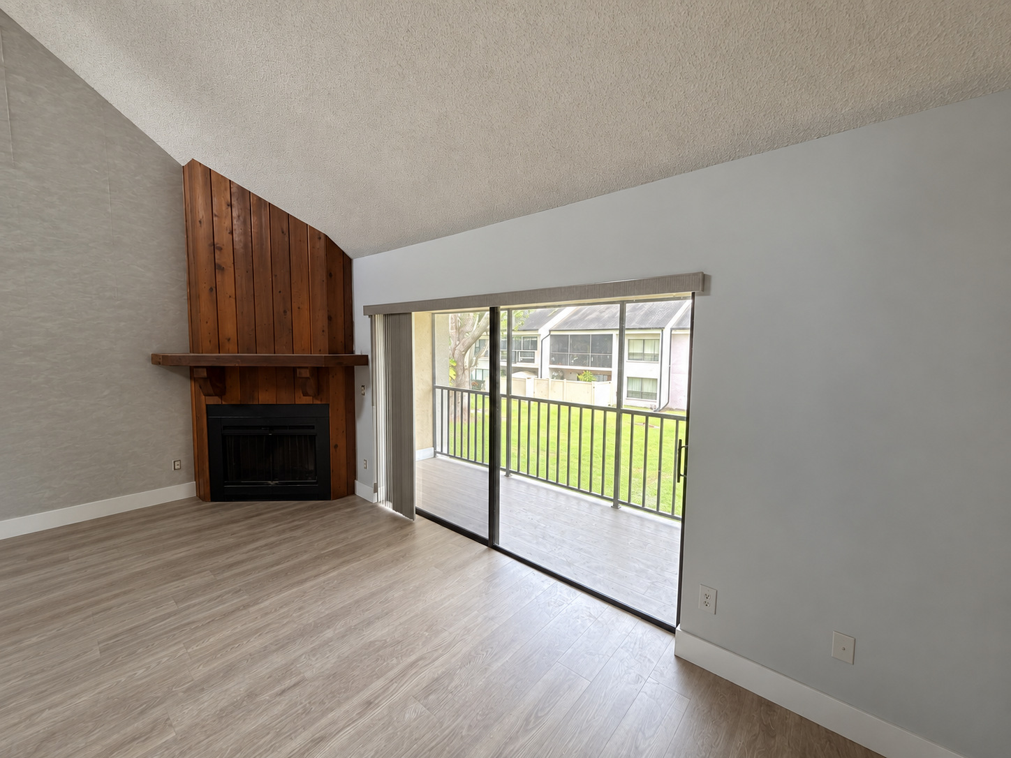 Living room with fireplace and screened patio